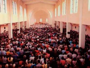 Crowded church with parishioners in the church Maximize space and budget with dividing room panels