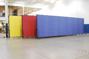 Three primary Colorsed Screenflex room dividers lined up Screenflex room dividers in three Colors