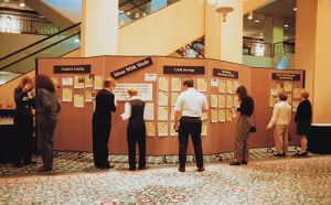 Hotels patrons view items displayed on a temporary wall