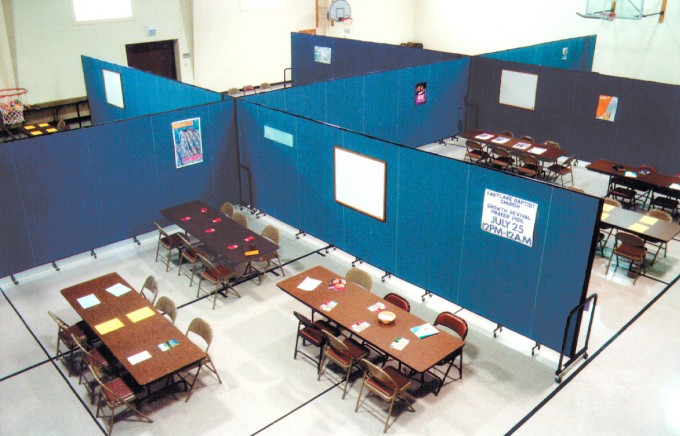 Using space efficiently by creating meeting rooms in a gym with room dividers