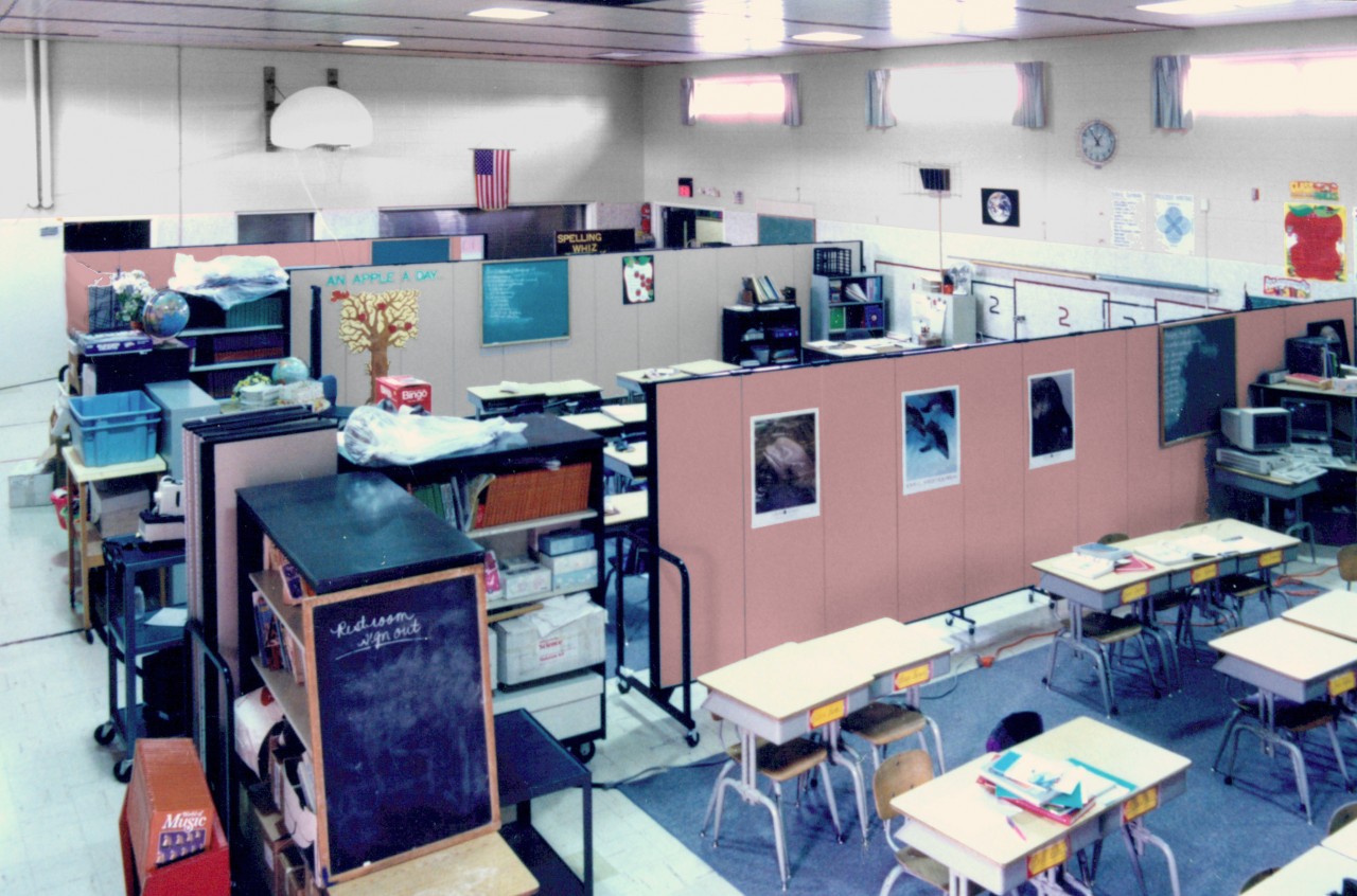 Two portable walls create three classrooms in gym during construction