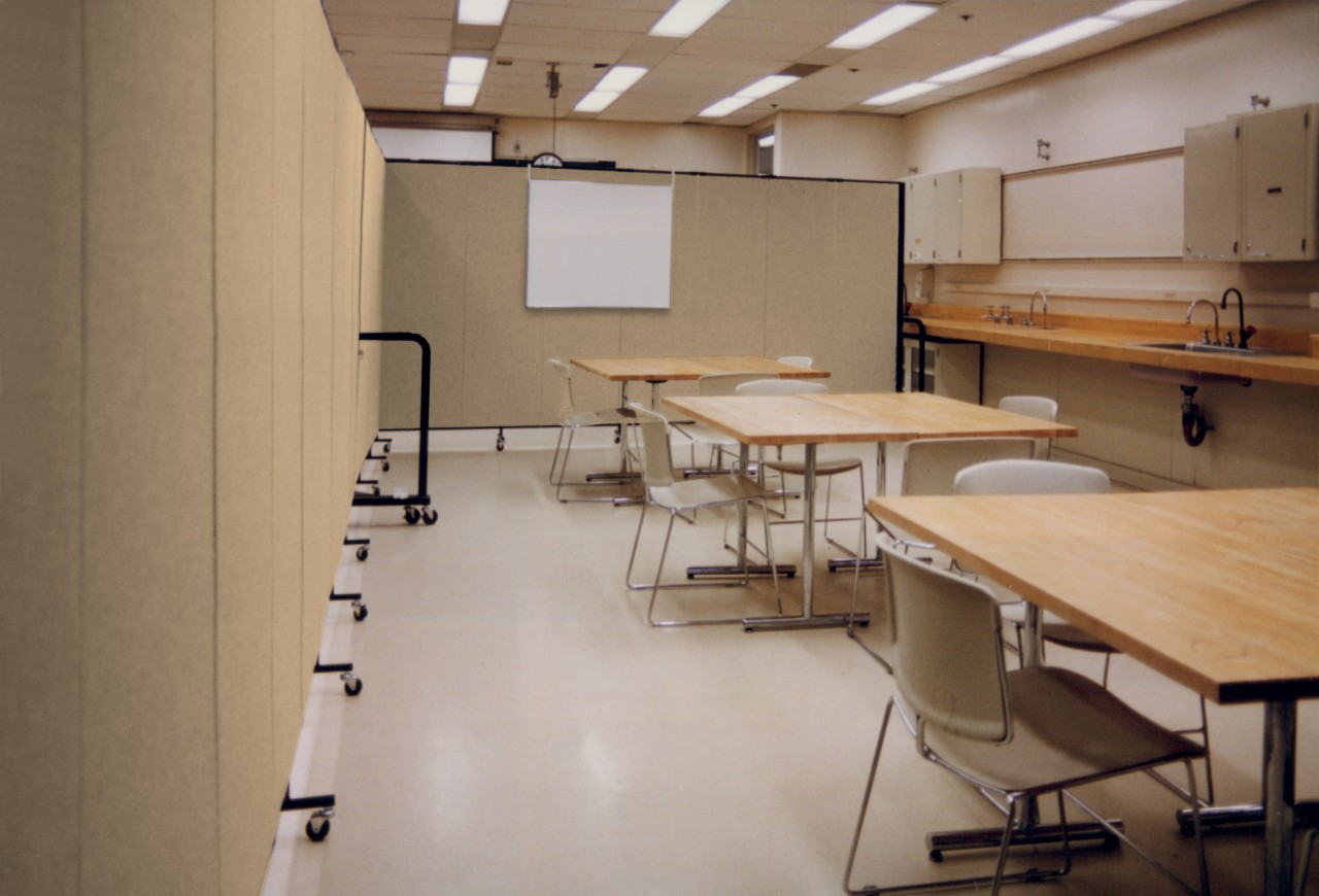 Acoustical dividers + markerboard + tables = classroom