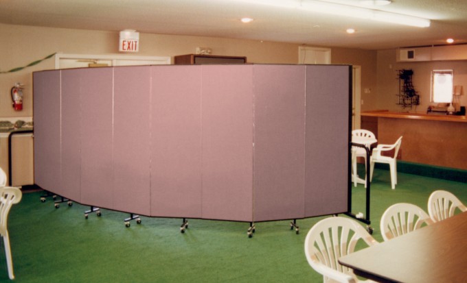 Counrty club room divider creating separate space for members to enjoy the golf tournament