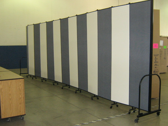 A portable room divider with alternating wet erase and fabric panels Room Divider and White Board - The best of both worlds