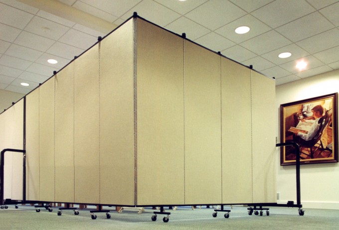 Two room divider walls connected to form one long wall in an L-shape