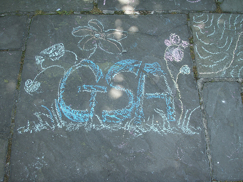 GSA written in chalk on a sidewalk