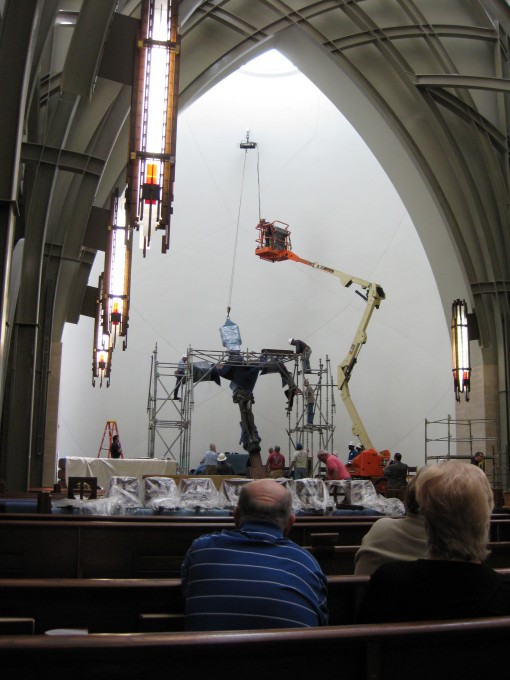 Christ on the Cross being raised into position