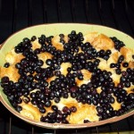 Blueberry Bread Pudding cooking in a bowl in the oven