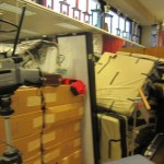 Screenflex Room Divider Walls shield stacks of unused items in an office.