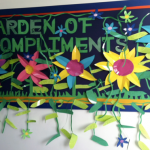 This garden of compliments bulletin board features ivy and Colorsful flowers