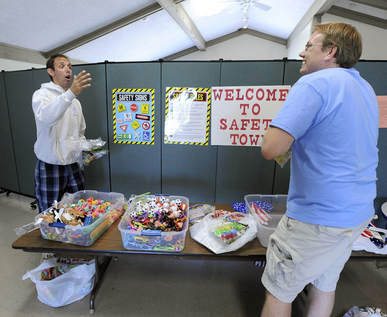 Posters hung on a room divider in a park room educated students Dividing Space at the Lake Zurich's Park Park and Recreation Building