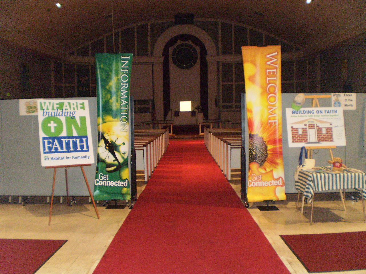 Room Dividers along each side of the aisle at the rear of the pews in a church sanctuary