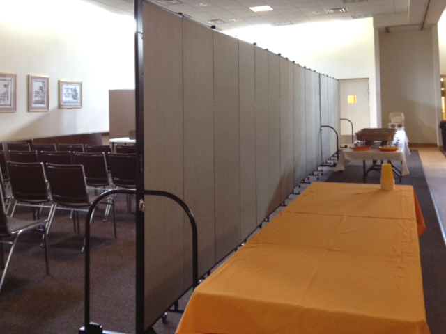 Room dividers separate conference room from eating area