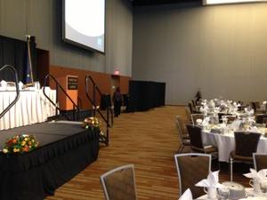 Room divider walls form a private entryway in a large banquet hall