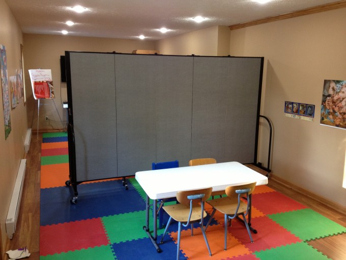 Portable classroom walls separate a room in two 