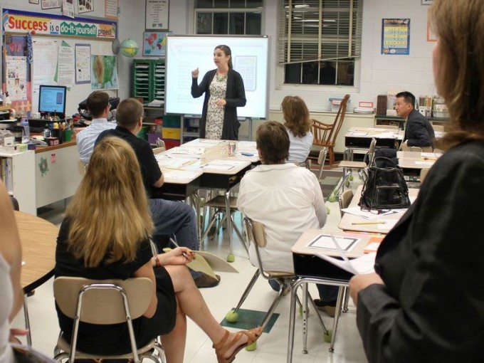 Teacher and parents at a School Open House 