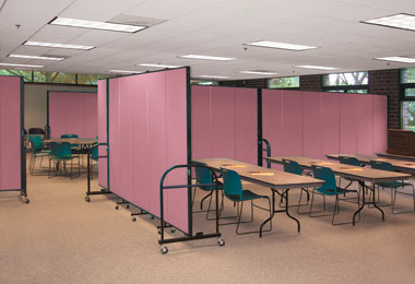Mauve heavy duty room dividers create multiple meeting rooms within a larger room.
