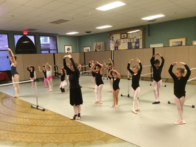 Wall divider creates privacy for a girls ballet class 