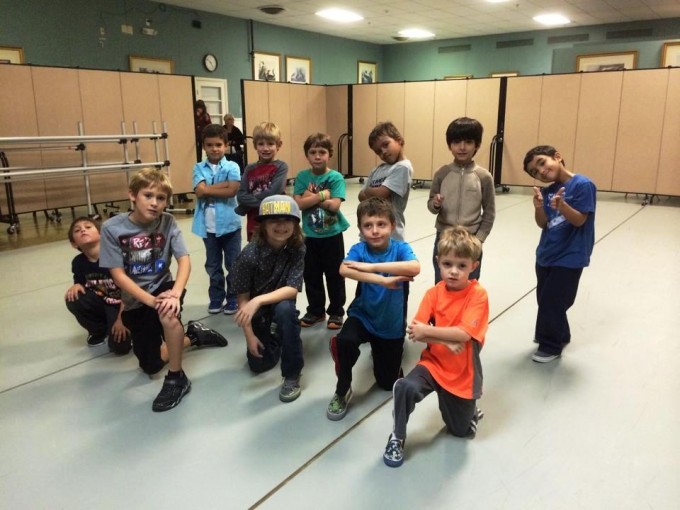 Wall dividers improve privacy during a boys hip hop class