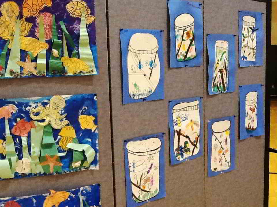 Student artwork displayed on Screenflex room divider