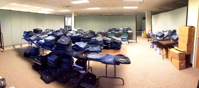 Sorted jeans on tables are hidden from view with the help of portable partitions 