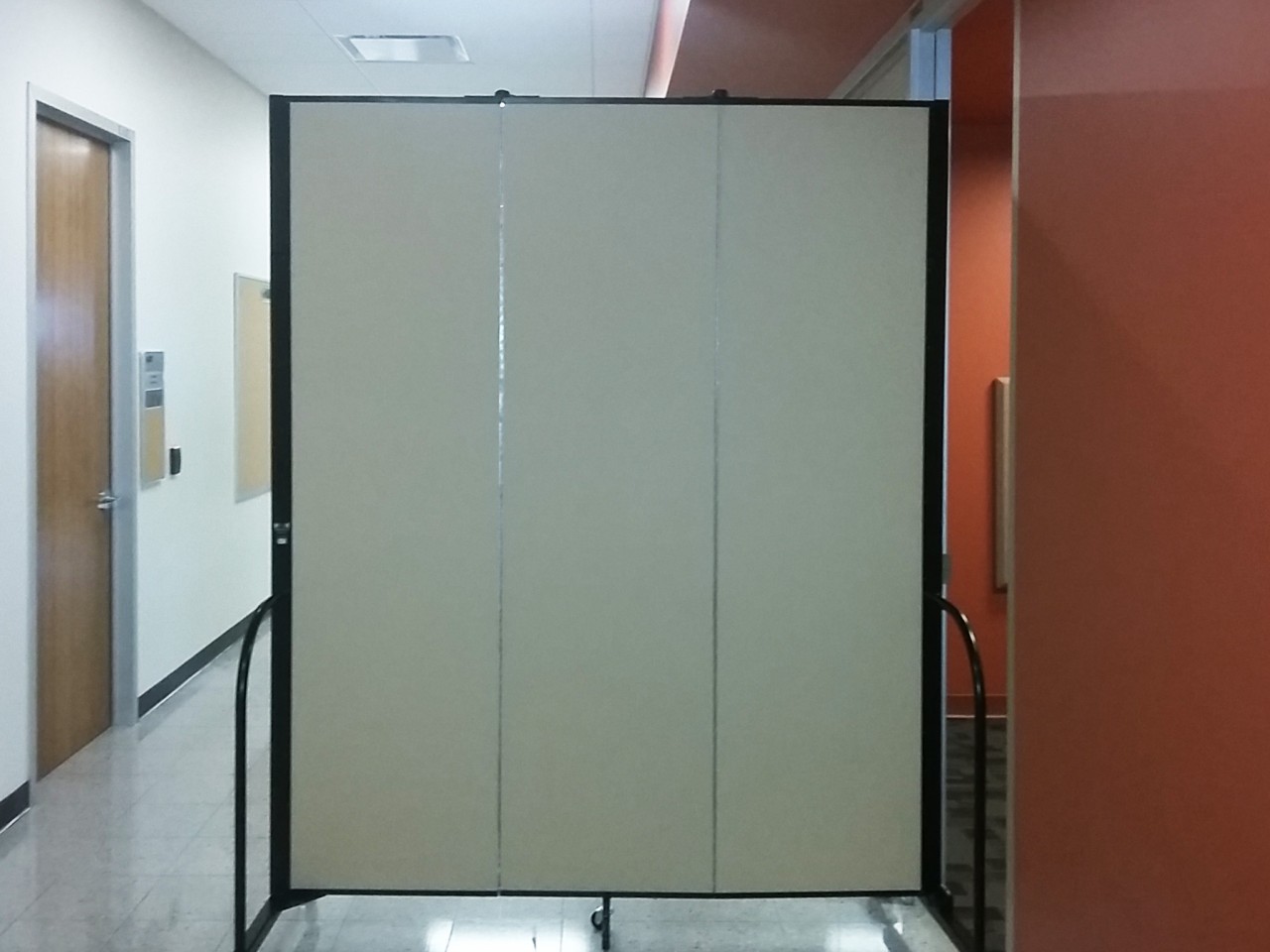 Sound absorbing panel in a hallway