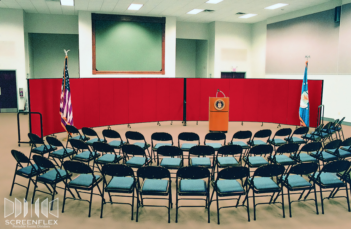 Movable press conference backdrop behind a podium