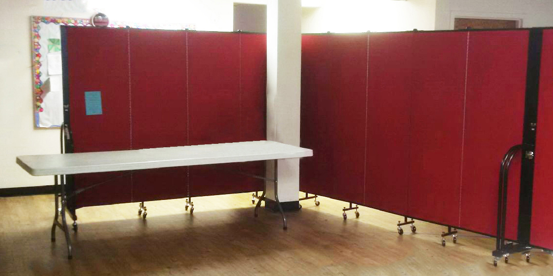 Red room dividers attached together to make room