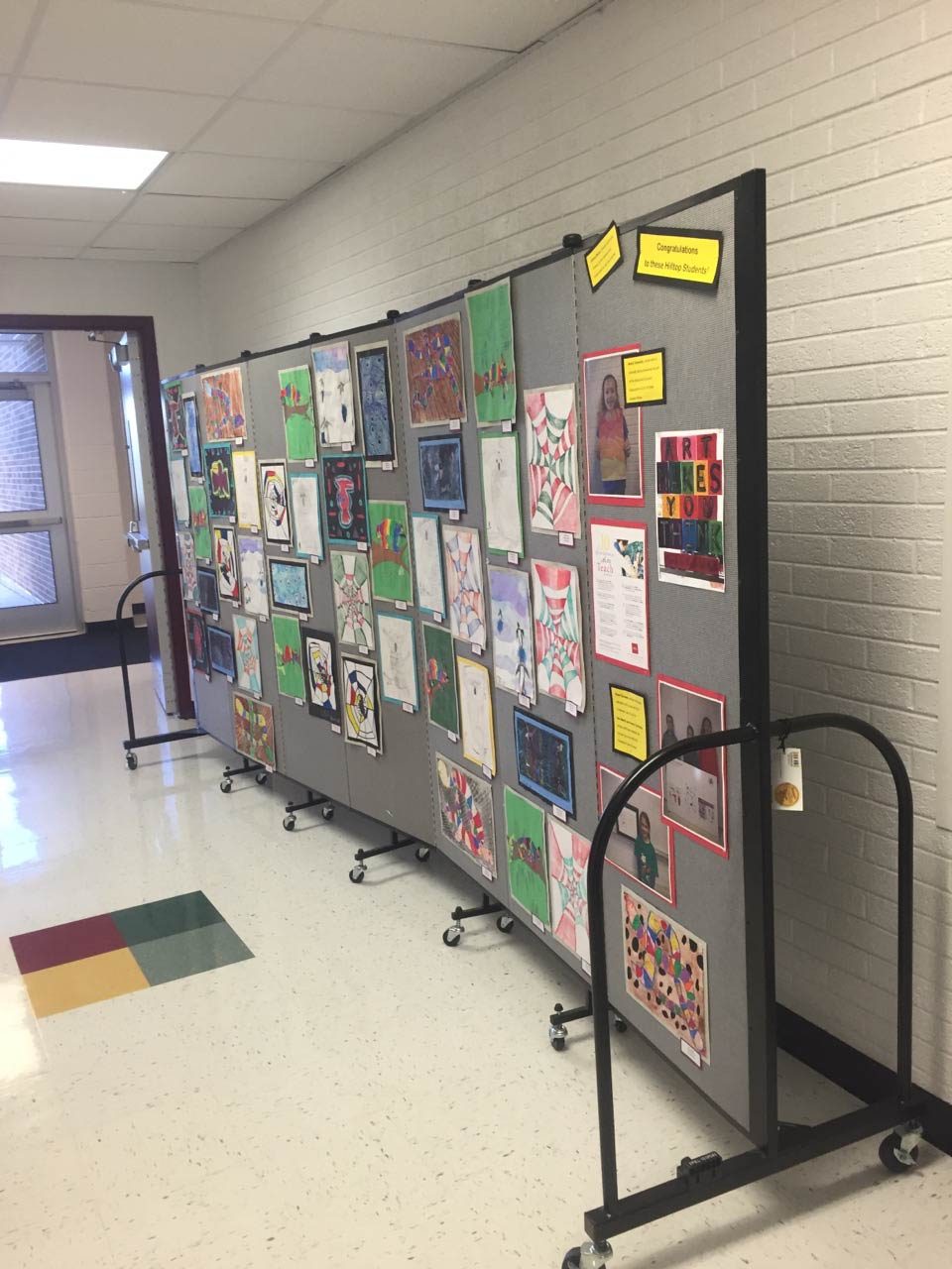 Tackable walls display artwork in a school hallway