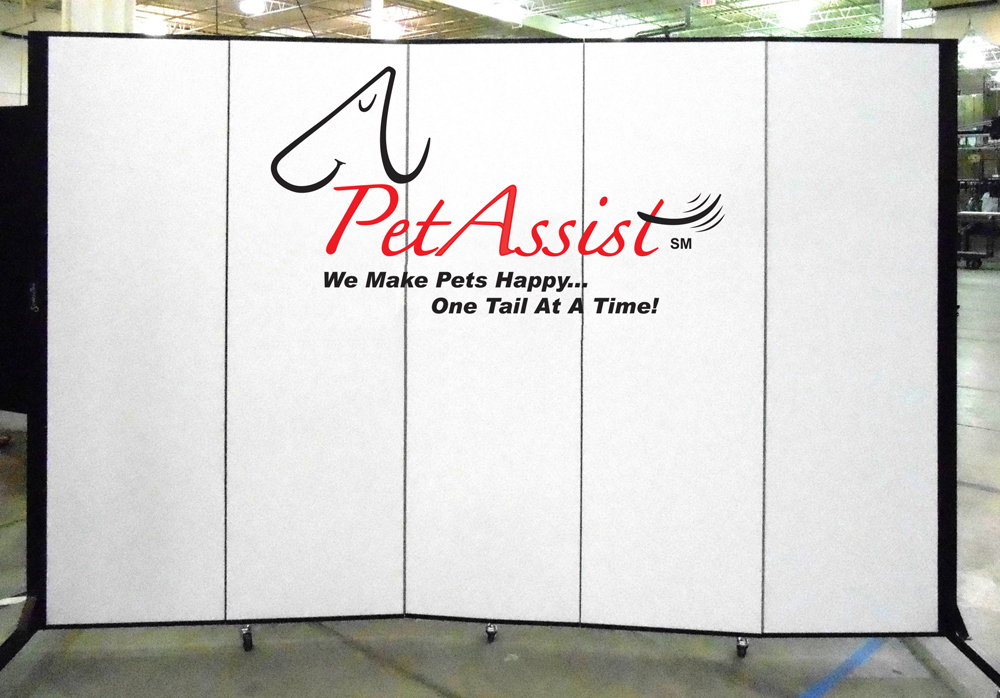 Pet Assist logo on a white portable room divider